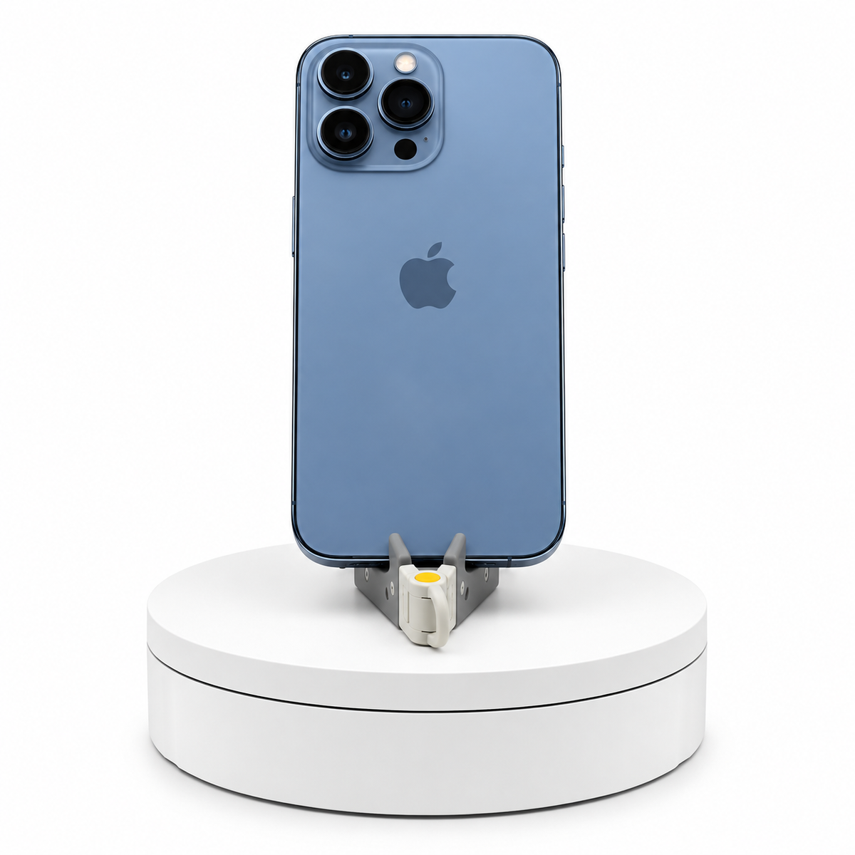 iPhone 13 Pro 128GB Sierra Blue, back view on a display stand
