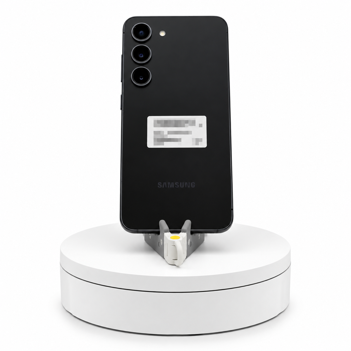 Samsung Galaxy S23 128GB Phantom Black, back view on a display stand