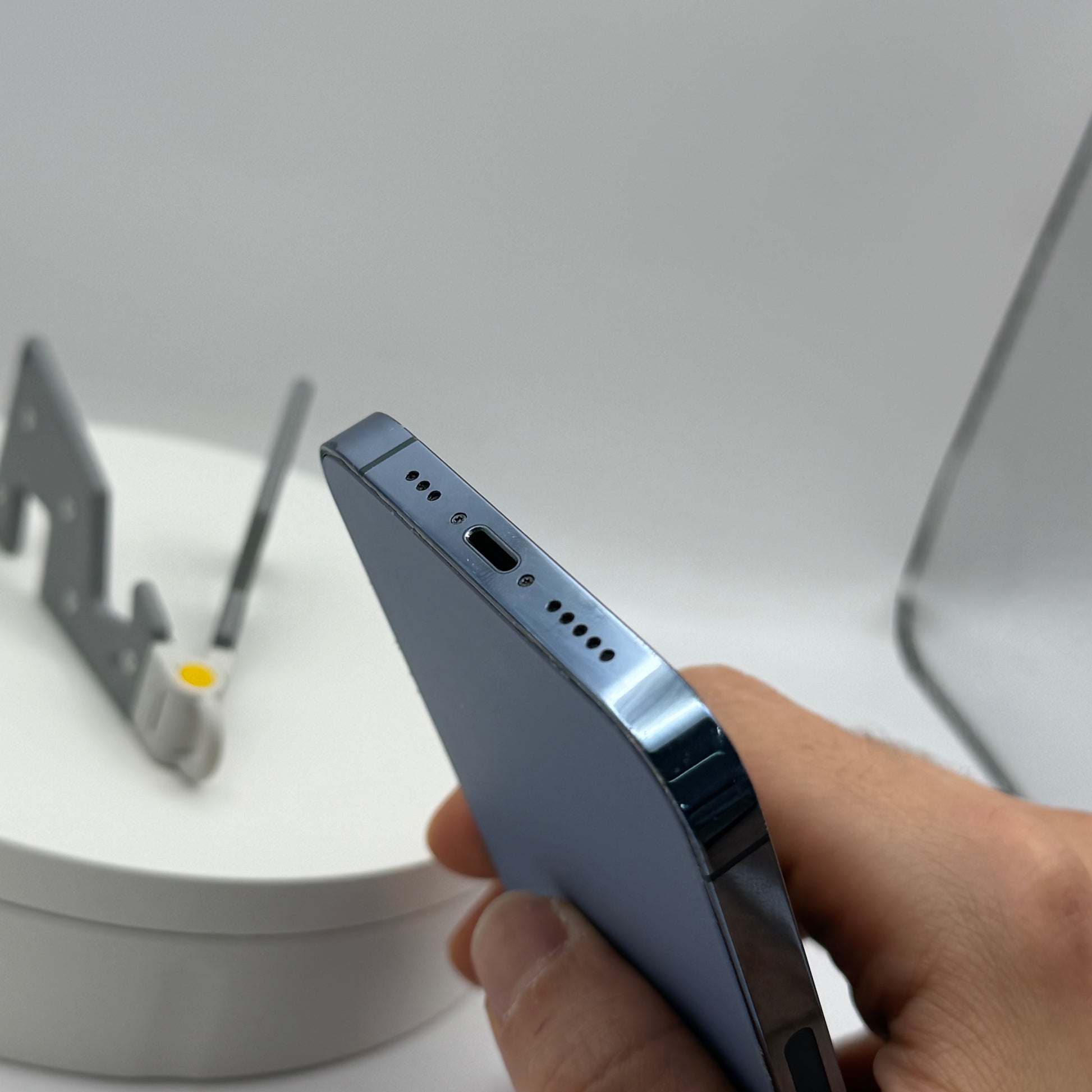 iPhone 13 Pro Sierra Blue side view with volume buttons