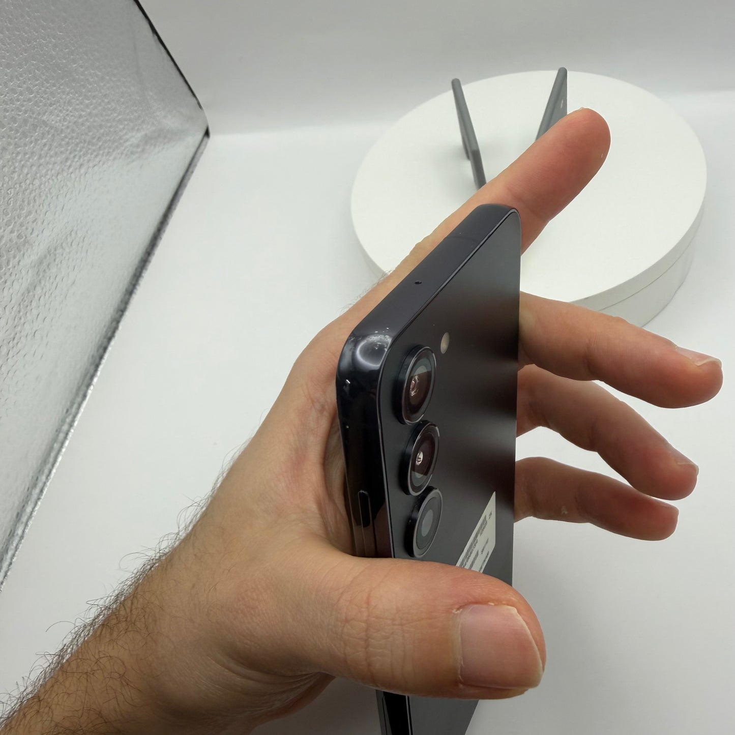 Samsung Galaxy S23 side profile held in hand showing the frame