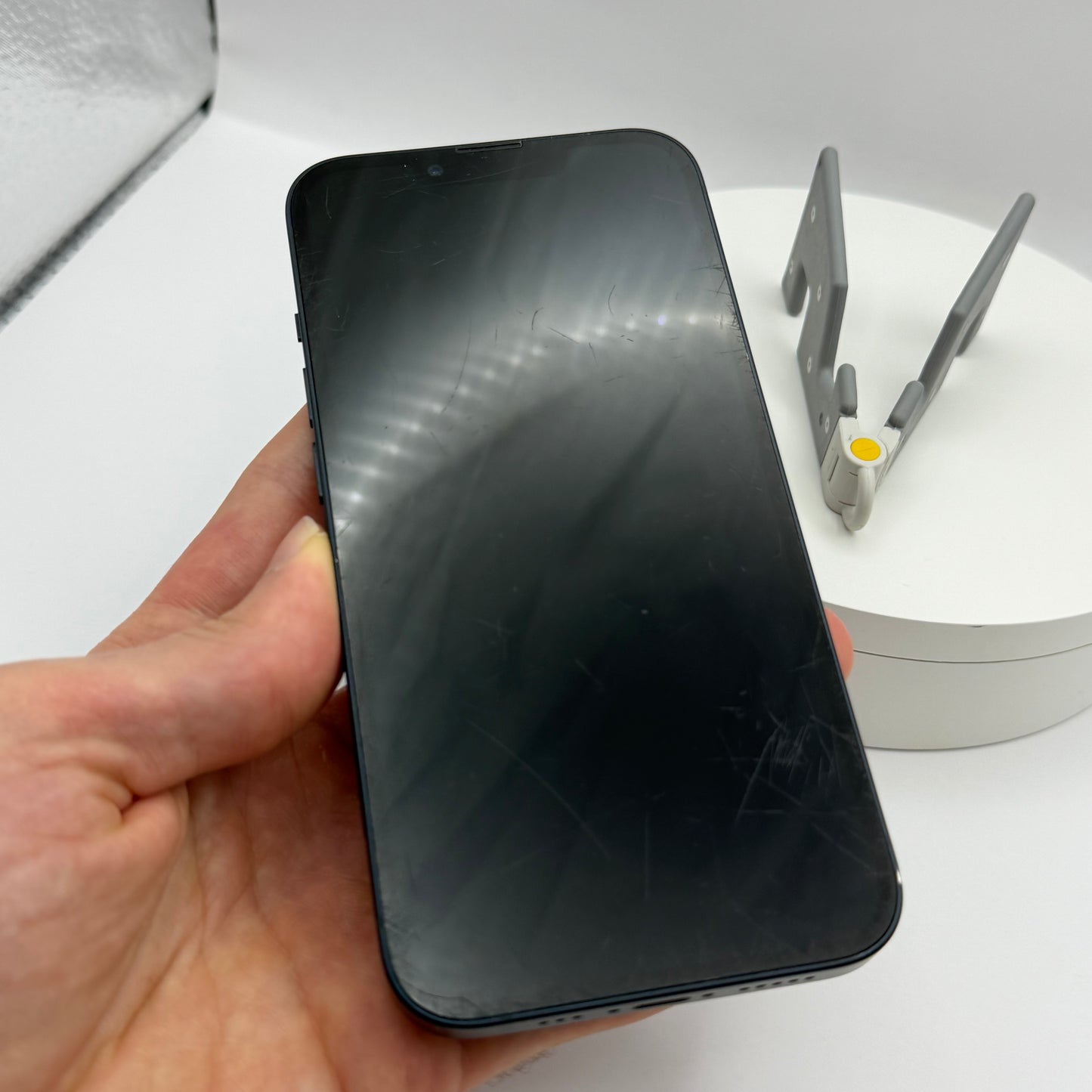 iPhone 13 128GB Midnight, front screen held in hand